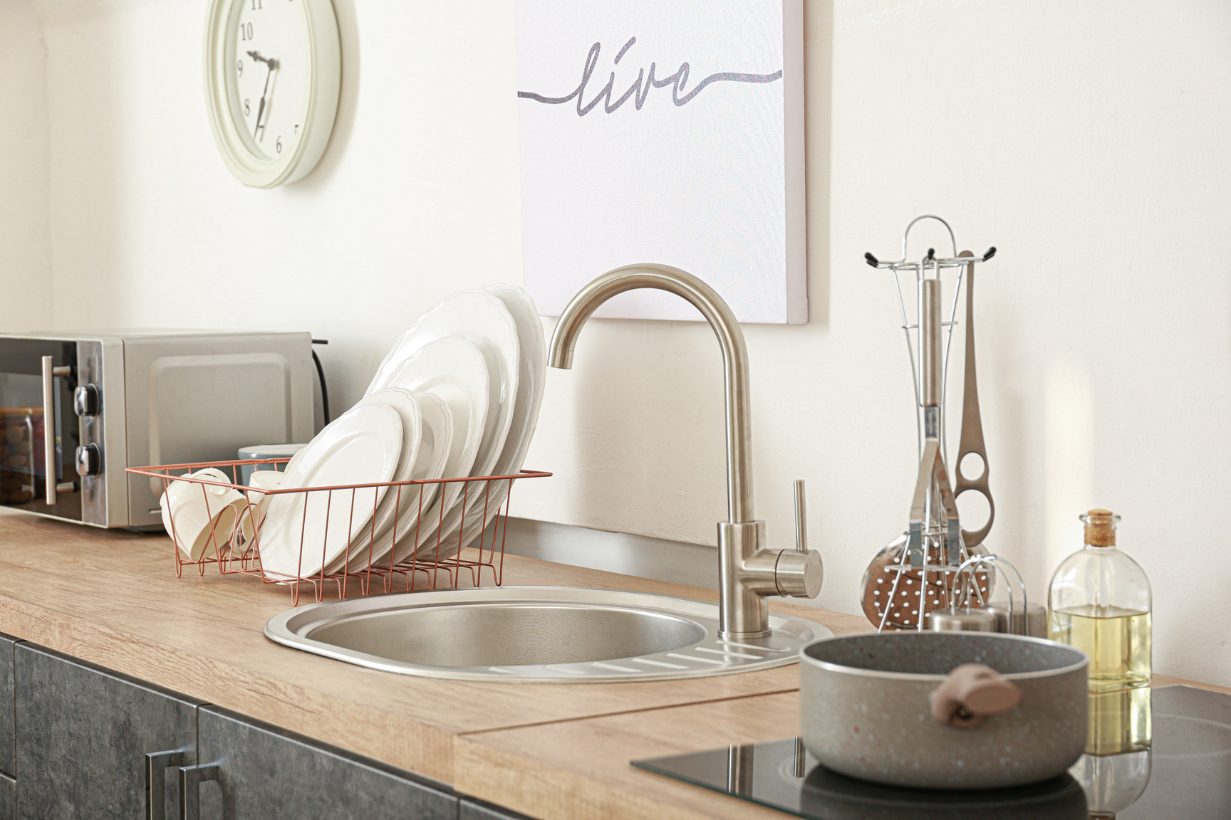 Set of Clean Dishware near Kitchen Sink